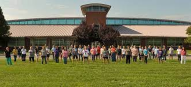 A large group of students and teachers pose outside a Bedford County public school.