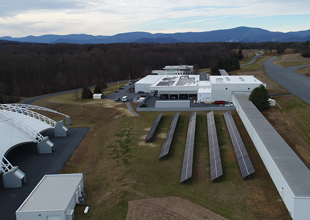 Aerial view of the IIHS facility showing roof and ground mounted solar arrays.
