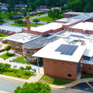 An aerial view shows solar panels on the roof of Orange High School in Virginia.