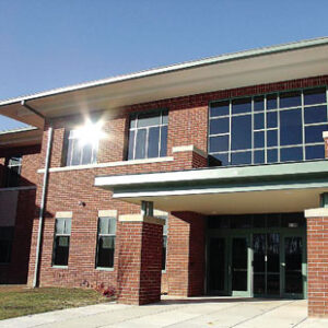 Sunlight reflects off the windows on the front of Locust Grove Middle School in Orange County, Virginia.